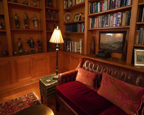Warm ambient lamp illuminating a study room corner in the evening for comfortable reading